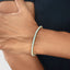 Front view of 3mm yellow gold diamond tennis bracelet with polished finish
