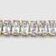 Yellow gold baguette tennis bracelet, continuous chain link detail
