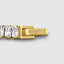 Yellow gold baguette tennis bracelet, close angled detail studio shot
