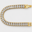 Macro detail of baguette diamond stones, yellow gold tennis bracelet
