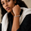 DVNCI baguette tennis bracelet stacked wrist jewelry lifestyle shot luxury London