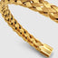 DVNCI basket weave cuff bangle worn on wrist lifestyle shot 18k gold luxury jewelry
