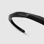 DVNCI black twisted cuff bangle engraved branding detail stainless steel luxury