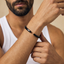 DVNCI black twisted cuff bangle model lifestyle editorial shot London luxury