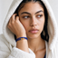 DVNCI blue woven silk cord bracelet flat lay product shot white background gold tips
