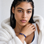 DVNCI unisex blue magnetic bracelet worn on man's wrist with watch lifestyle shot
