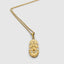 DVNCI Capricorn zodiac pendant necklace worn by model lifestyle shot gold jewelry
