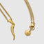 Close up DVNCI cornicello pendant Italian horn curve detail 18k yellow gold

