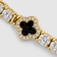DVNCI yellow gold clover bracelet layered wrist stack styled shot luxury jewelry London
