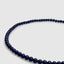 Close up DVNCI lapis lazuli natural stone necklace worn on model neck detail shot
