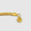 DVNCI yellow gold milgrain bracelet layered with watch and bracelets stacked wrist styling
