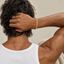 DVNCI unisex milgrain Cuban link bracelet worn on man's wrist with watch lifestyle shot
