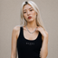 Close up DVNCI white gold milgrain Cuban link chain necklace worn on model neck