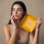 DVNCI mustard yellow vegan nappa leather jewelry tray flat lay overhead shot