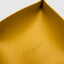 DVNCI mustard yellow vegan leather jewelry tray styled with rings necklaces earrings