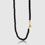 Close-up of natural onyx beads showing smooth polished surface
