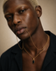 DVNCI black onyx pendant wheat layered chain necklace model lifestyle editorial shot London