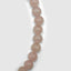 DVNCI pink quartz natural stone necklace side angle studio shot white background
