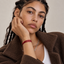 DVNCI red woven silk cord bracelet flat lay product shot white background gold tips
