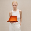 DVNCI saffron orange vegan leather jewelry tray bedside table lifestyle shot