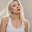 DVNCI Sagittarius zodiac pendant necklace worn by model lifestyle shot gold jewelry
