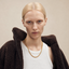 Close up DVNCI wheat chain necklace worn on model neck detail shot 18k gold filled
