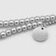 DVNCI white gold cluster ball bracelet engraved branding tag detail luxury jewelry
