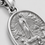 Close up DVNCI white gold Fatima medal Virgin Mary apparition scene detail
