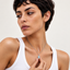 White gold Hamsa evil eye pendant necklace, luxury gift packaging shot
