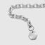 DVNCI lip link chain light reflection across polished flat oval links white gold
