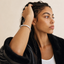 DVNCI white gold twisted cuff bangle worn on wrist lifestyle shot luxury jewelry
