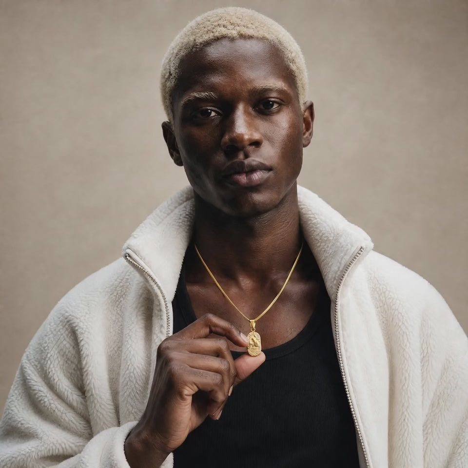 Kai is wearing our stunning DVNCI Aquarius birthstone Zodiac Star sign pendant in gold