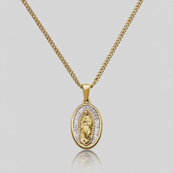 Close up DVNCI Virgin Mary pink pearl pendant necklace worn on model neck detail