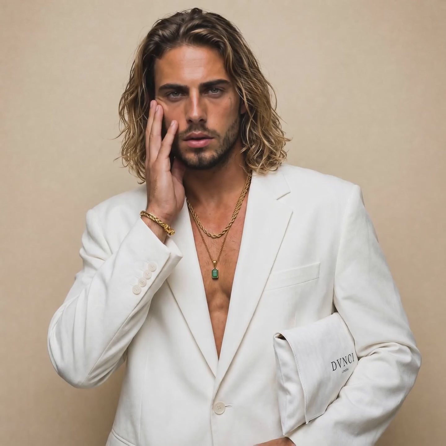 Brett wears a beautiful jade stone pendant necklace