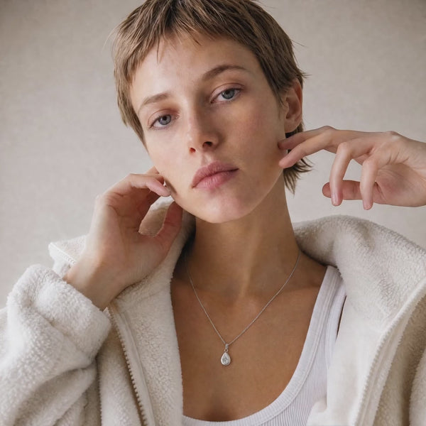 Kaaia is wearing our stunning Polaris North Star pendant in 18k white gold