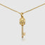 Stylish yellow gold skull key pendant with moissanite detail